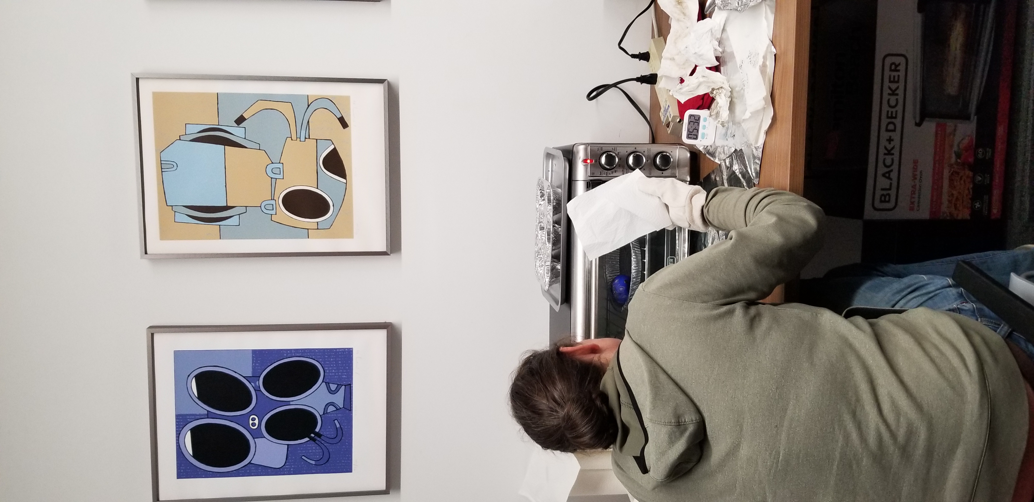 student waits for toaster oven to melt off wax